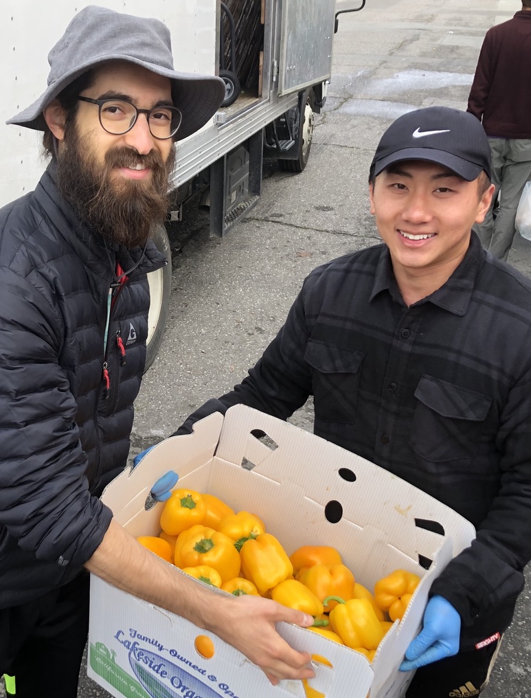 Magic resident Max with vendor donor at Farmers Market